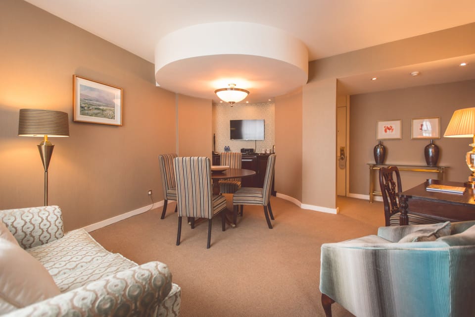 Junior Suite, 1 King Bed | Living area | TV, iPod dock