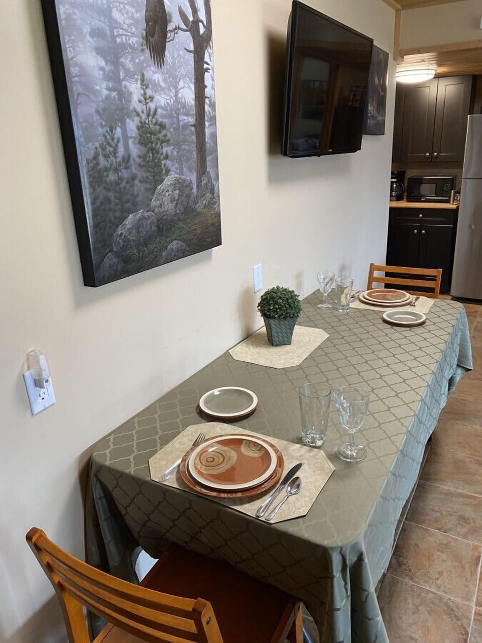 The dining table set for two people.