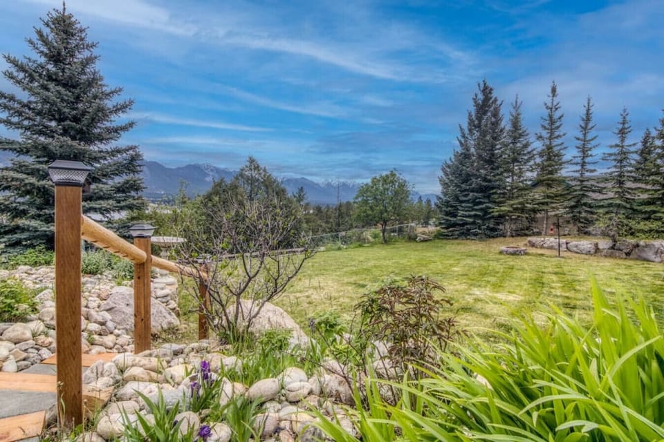 Expansive mountain views visible from the yard.
