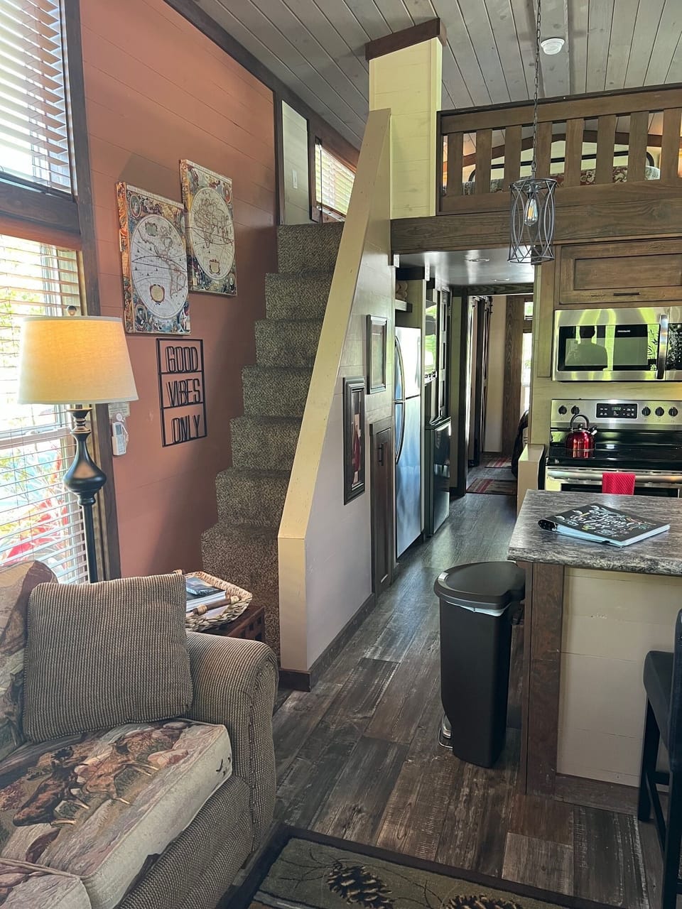 Stairs from the living area to the loft which has a queen size bed.  