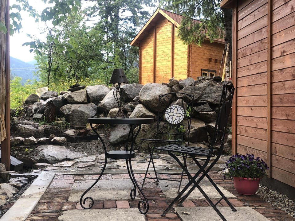 A shady and romantic spot to hang out behind the kitchen bunkie