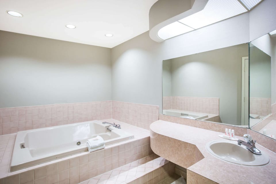 Suite, 1 King Bed, Refrigerator | Bathroom | Bathtub, deep soaking tub, free toiletries, hair dryer