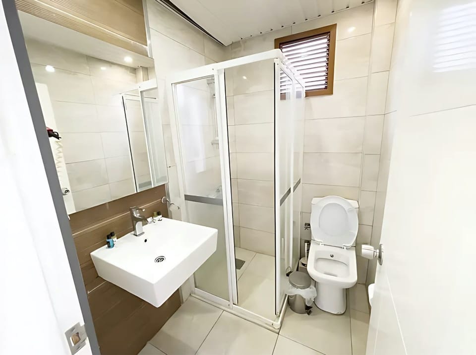Shower, rainfall showerhead, hair dryer, towels