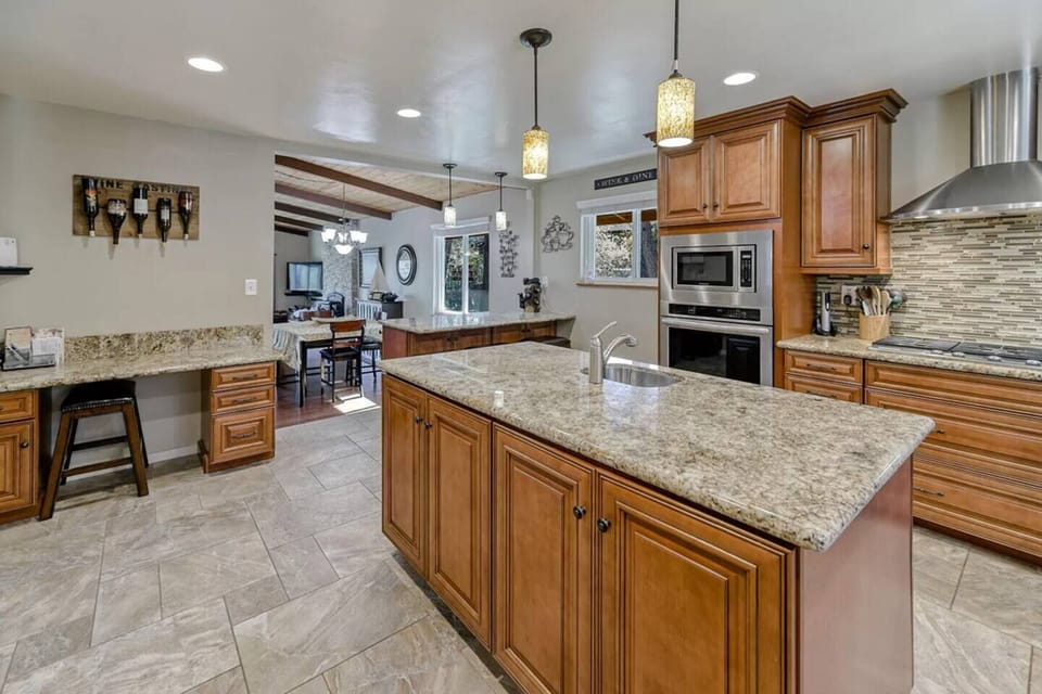 Custom granite and wood finishings on floor and cabinets.