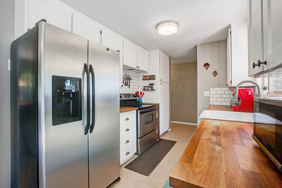 Full Kitchen with cooking supplies and spice rack
