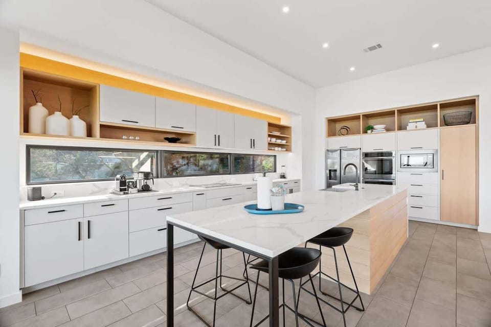 Bright chef’s kitchen with oversized island and premium finishes