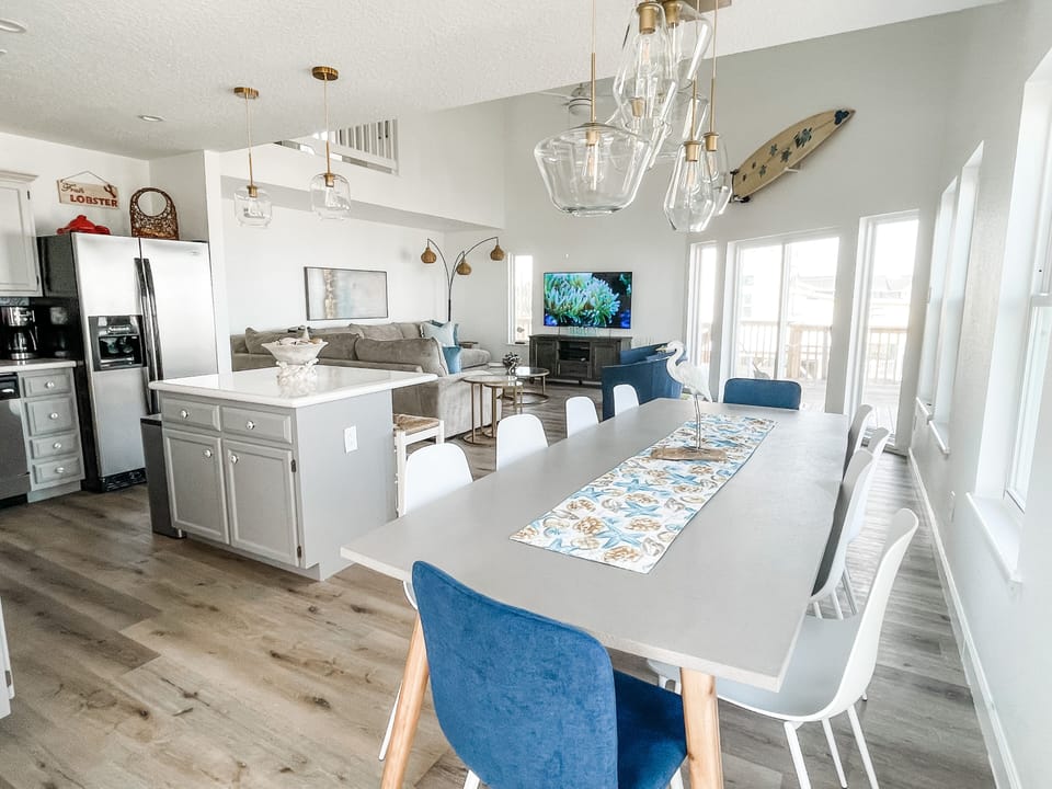 The dining table seats 10, great for meals and games.