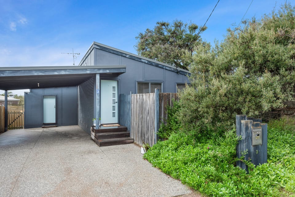 Front of home including carport