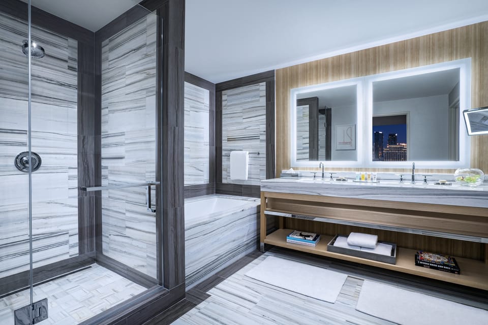 Fantasy Executive Suite | Bathroom | Designer toiletries, hair dryer, slippers, towels