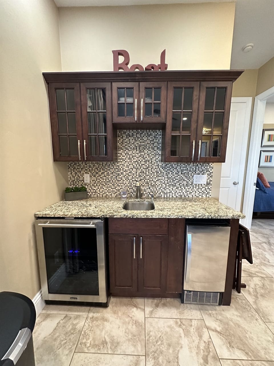 Fix up a cocktail at the wet bar complete with wine fridge and ice maker!