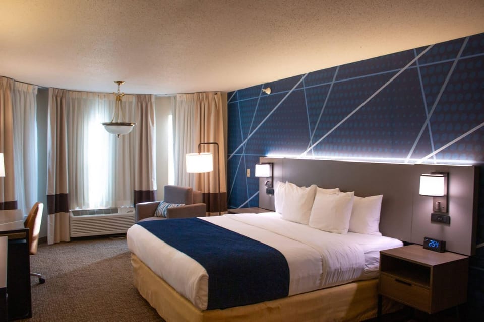 Desk, blackout drapes, iron/ironing board, free cribs/infant beds