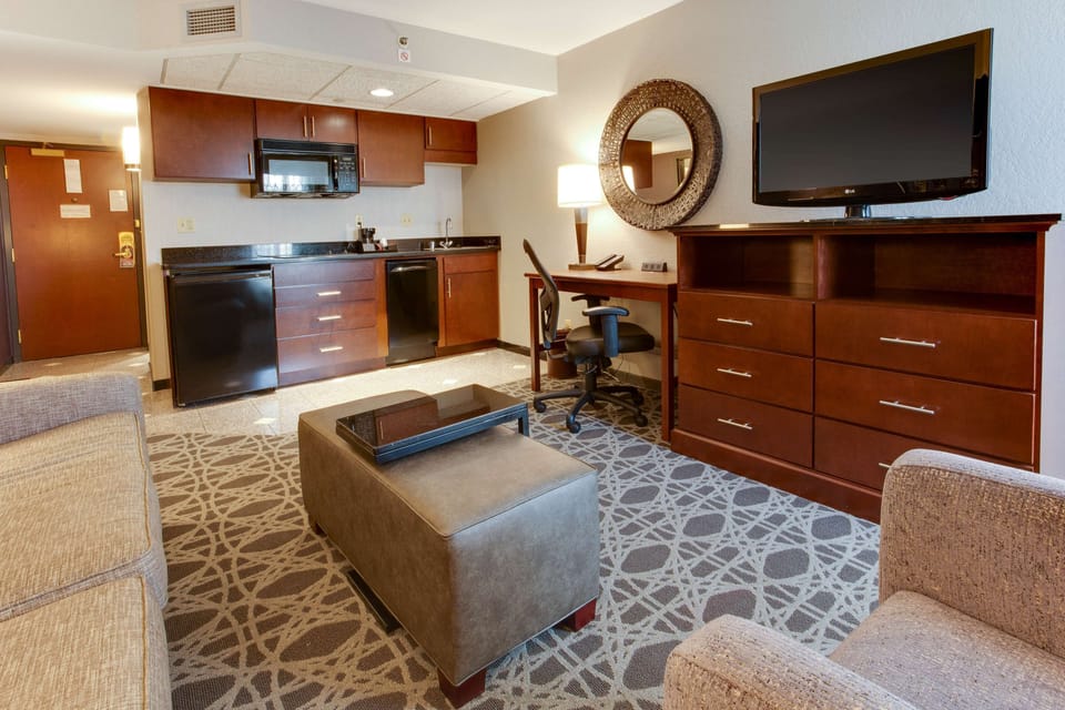 Desk, laptop workspace, blackout drapes, iron/ironing board