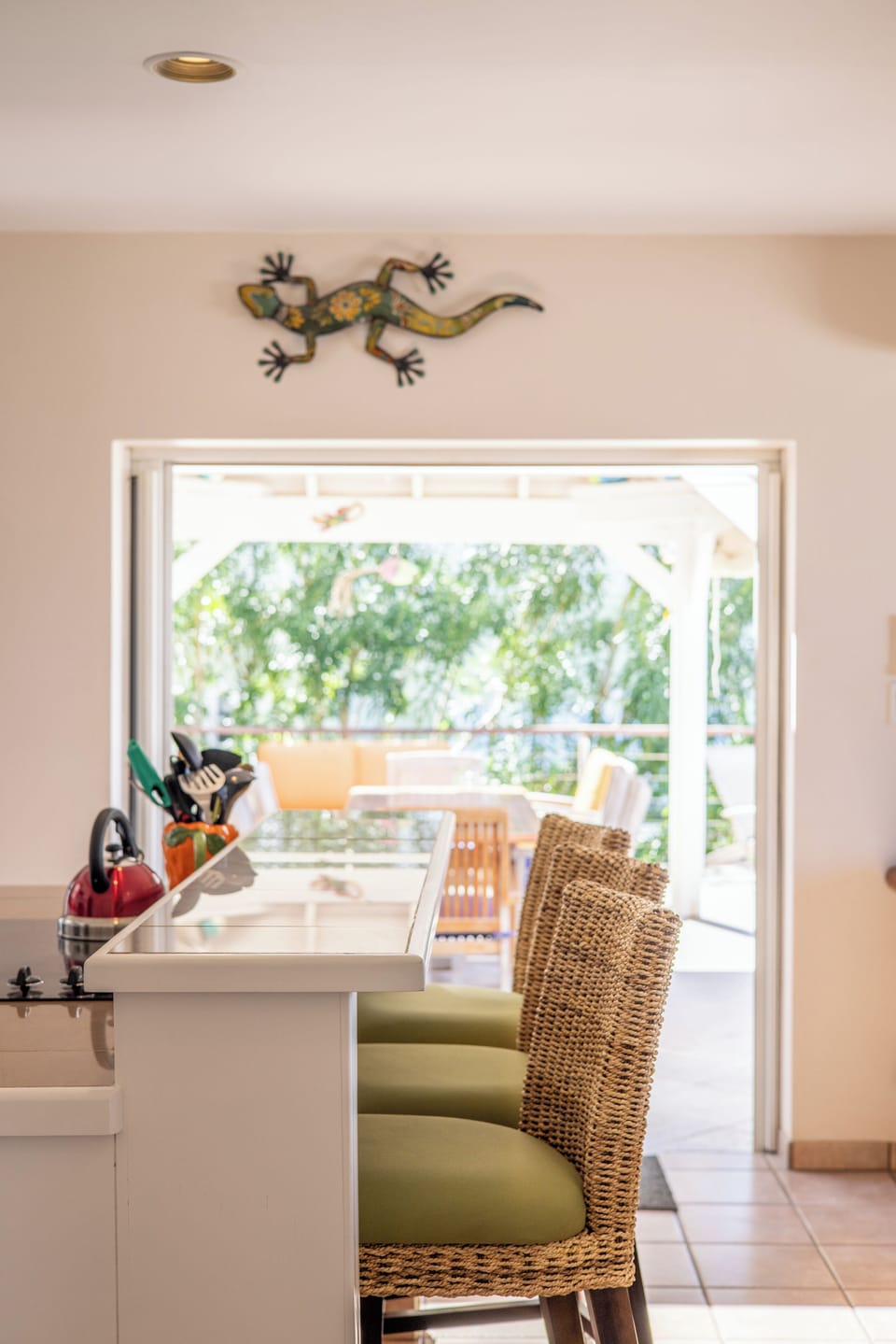 A breakfast bar separates the open-plan layout on the main floor/ garden suite 