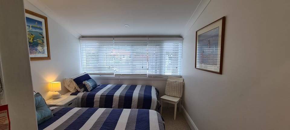 Bedroom 2 with 2 Single Beds looking at windows