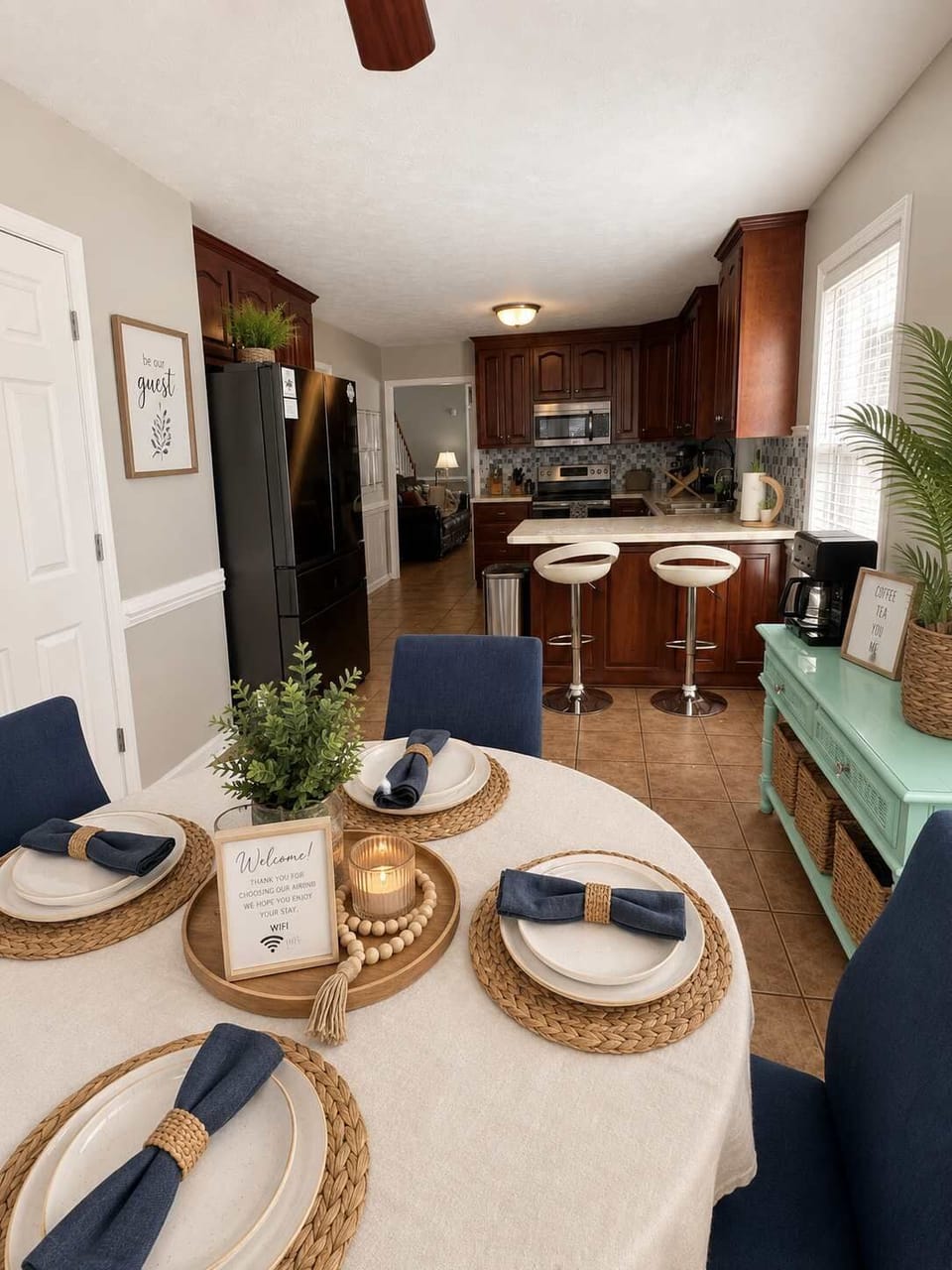 Kitchen nook table viewing into kitchen. Coffee bar on the right.
