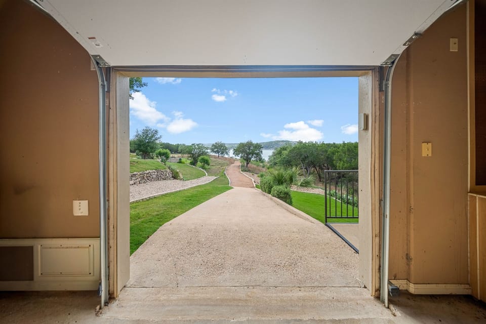 Tuscanys garage has two doors. Enter through the first door and exit through the back door to the cart path that leads to our private dock.