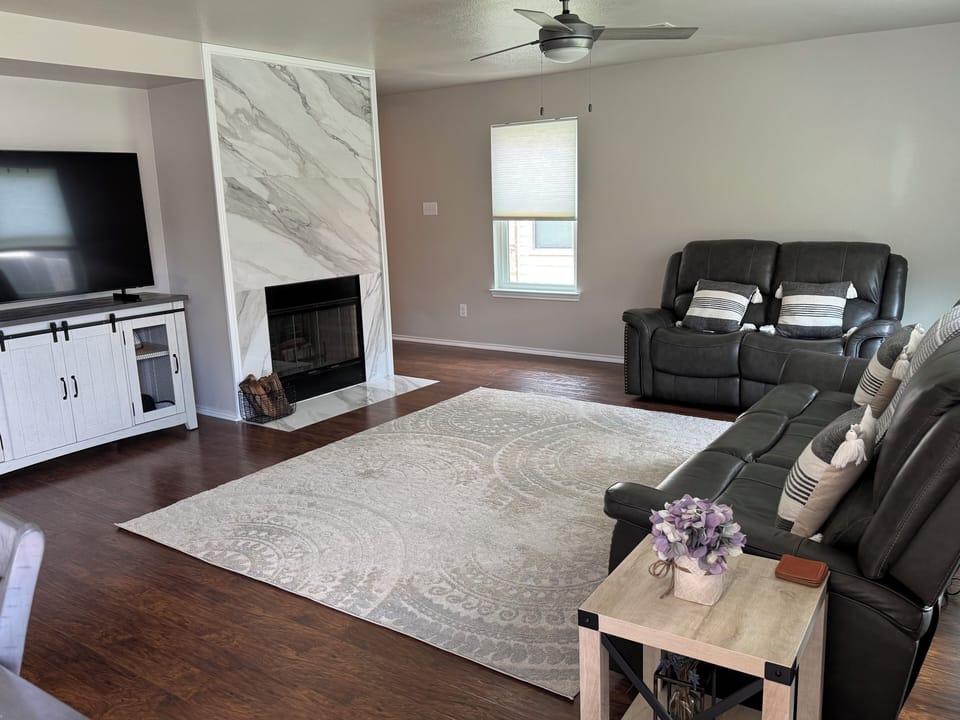 Spacious living room with recliner sofas 