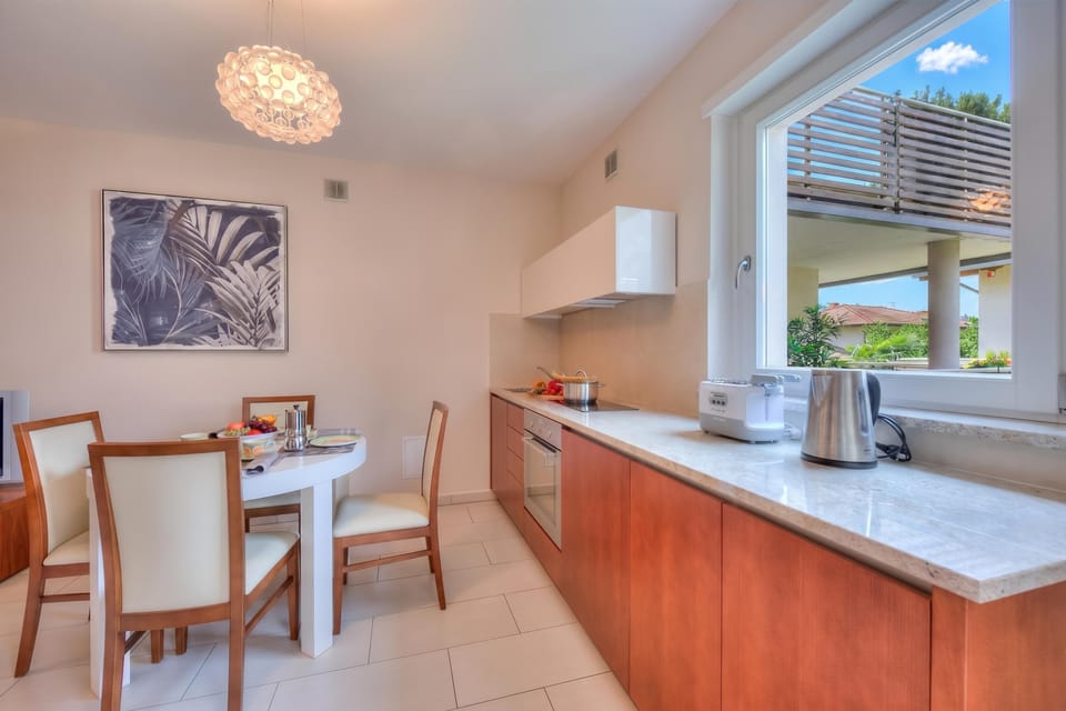 Family Apartment, Multiple Bedrooms (Casa Margherita Few Minutes From Lake) | Private kitchen | Fridge, oven, stovetop, coffee/tea maker