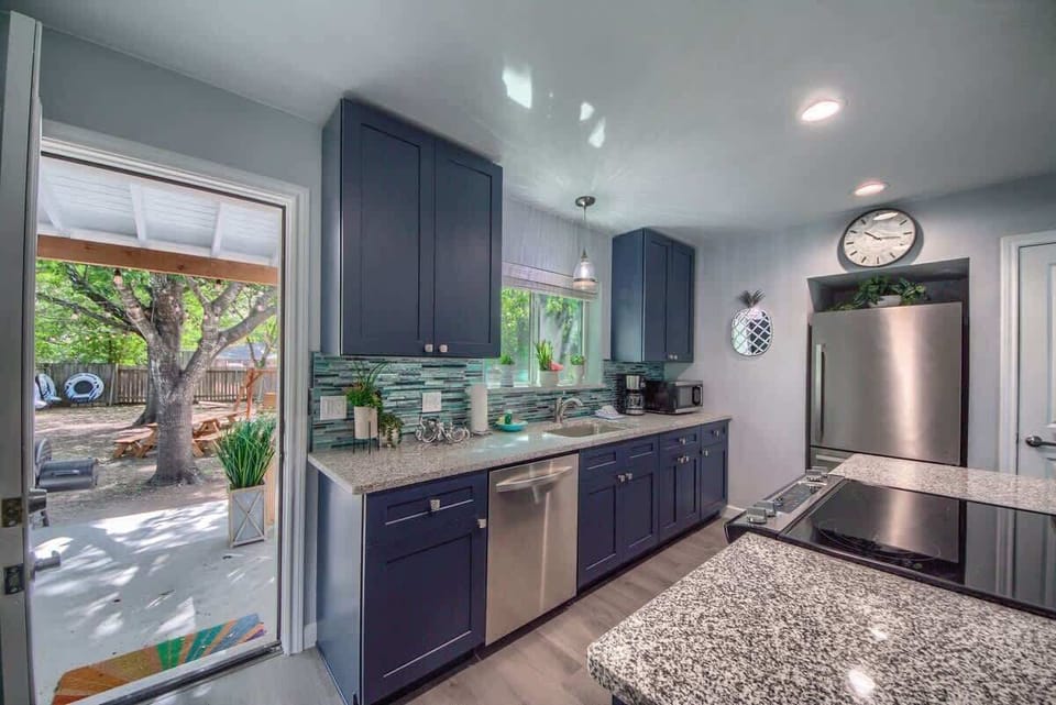 Kitchen and door leading to backyard