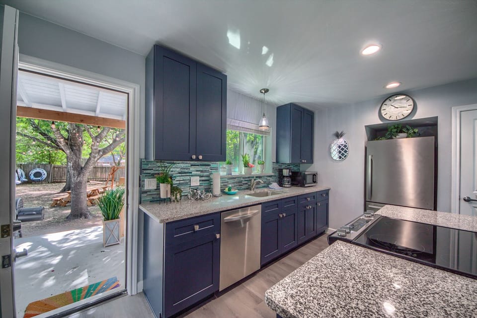Kitchen and door leading to backyard