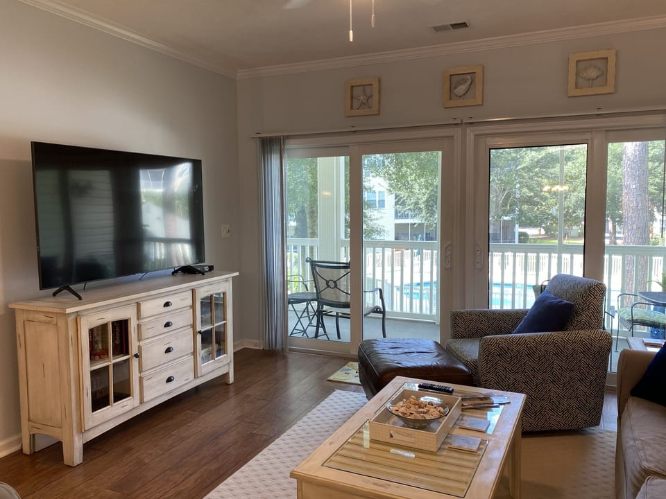 65" Smart TV is a man's delight. The pool view from the balcony is a lady's joy.