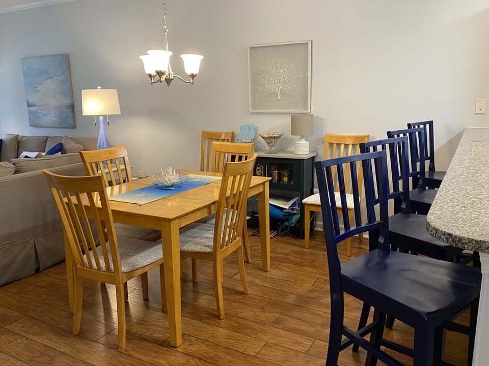 Table expands to sit six, and has 4 barstools for extra guests.