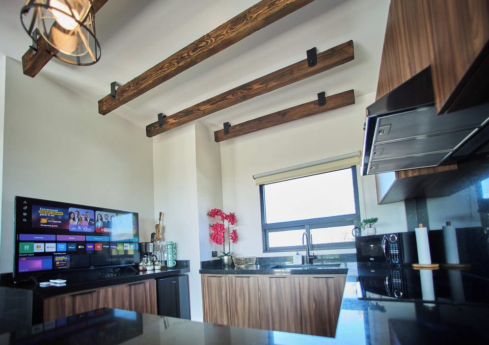 Grand Cabin | Private kitchen | Microwave, coffee/tea maker, cleaning supplies, freezer