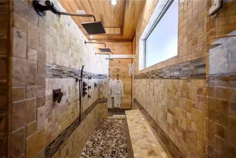 Count the shower heads!  The robes are ready for ya'll!