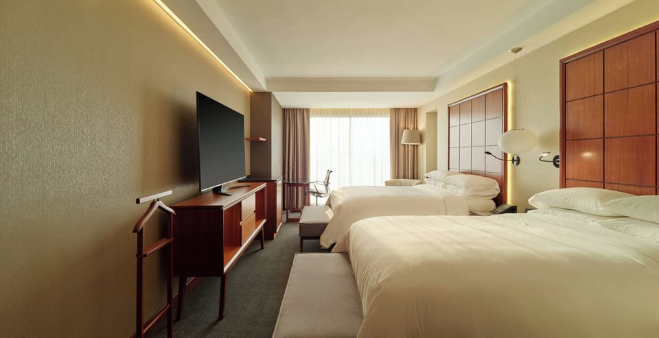 Premium bedding, down comforters, pillowtop beds, minibar