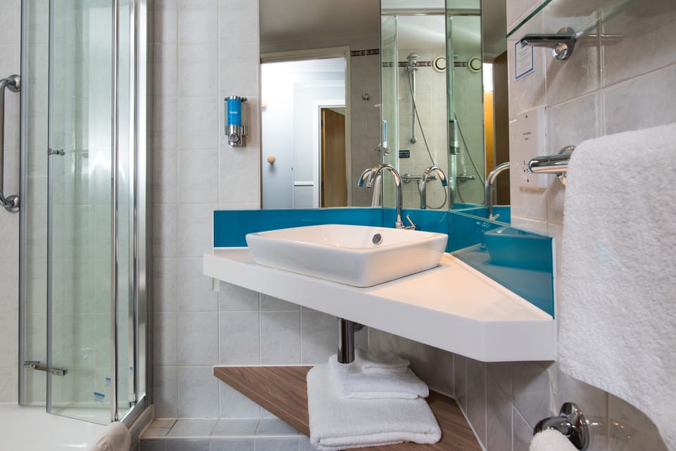 Shower, eco-friendly toiletries, hair dryer, towels