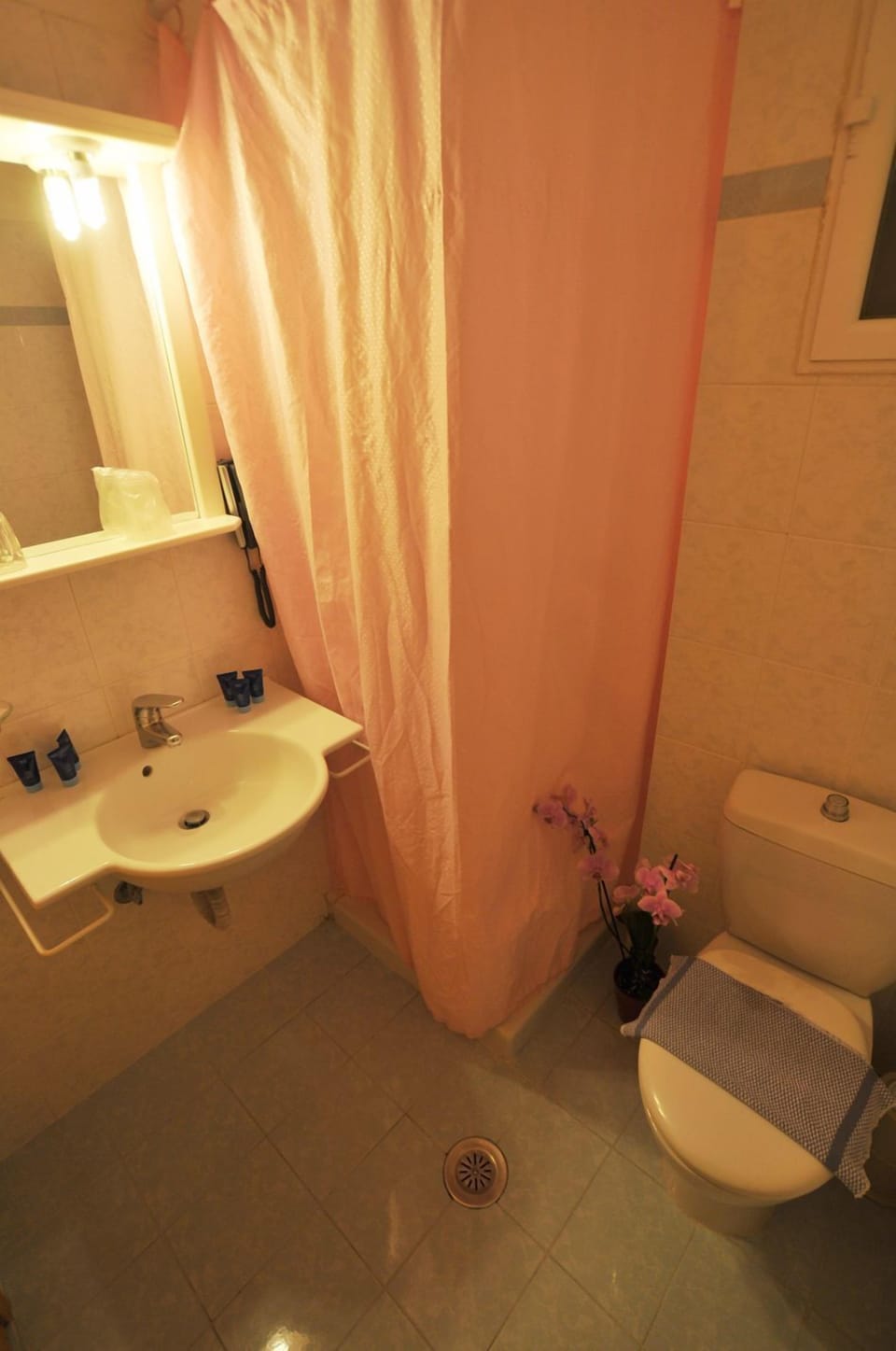 Deep soaking tub, rainfall showerhead, hair dryer, slippers
