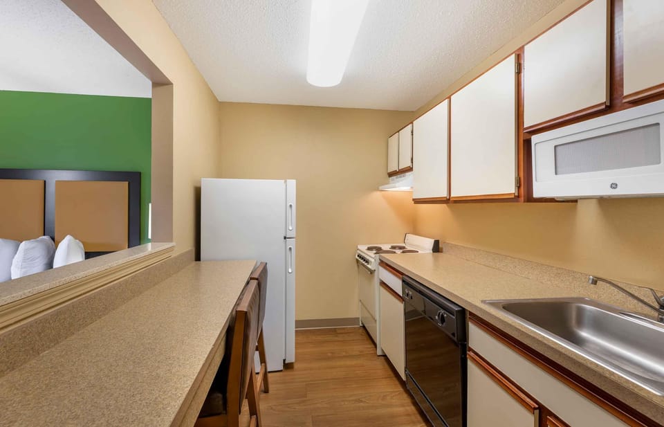 Studio, 2 Queen Beds, Non Smoking | Private kitchen | Coffee/tea maker, full-size fridge, microwave, stovetop