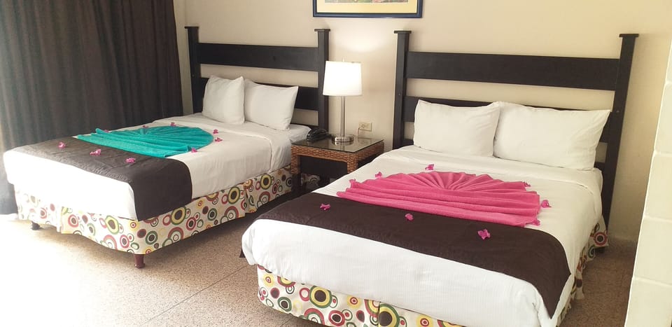 Deluxe Room, Ocean View | In-room safe, iron/ironing board (on request), WiFi (free), bed sheets