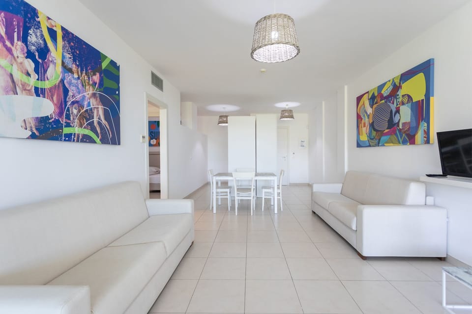Panoramic Suite, Sea View | Living area | Flat-screen TV
