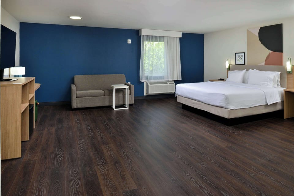 Room, 1 King Bed with Sofa bed | Living area | 50-inch Smart TV with cable channels
