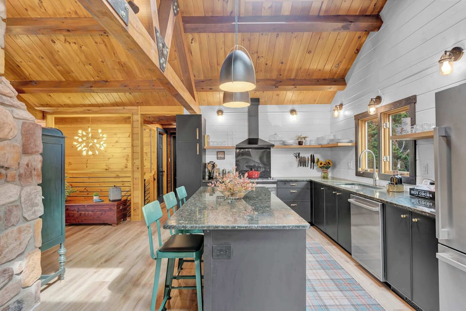 The brand new chef's kitchen features Boxi cabinets, stainless steel appliances, and everything you need to whip up meals for the whole family.  