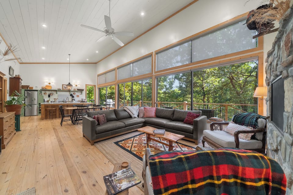 Living Room: Experience nature's beauty with large windows and stylish furnishings for relaxation!