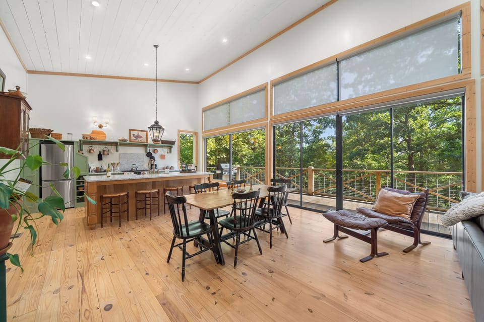 Dining Room: Gather around a rustic table with tree-framed views and a stylish, inviting atmosphere!