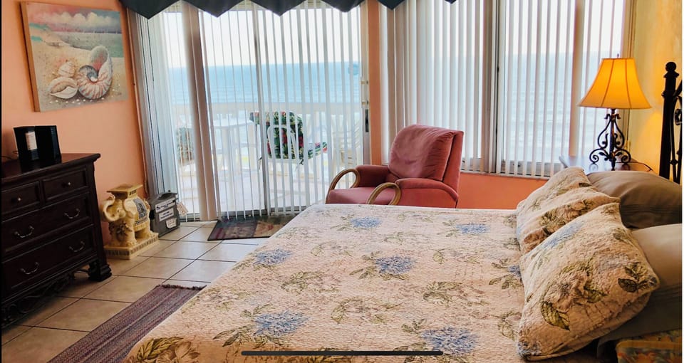 Master bedroom with ocean and balcony view