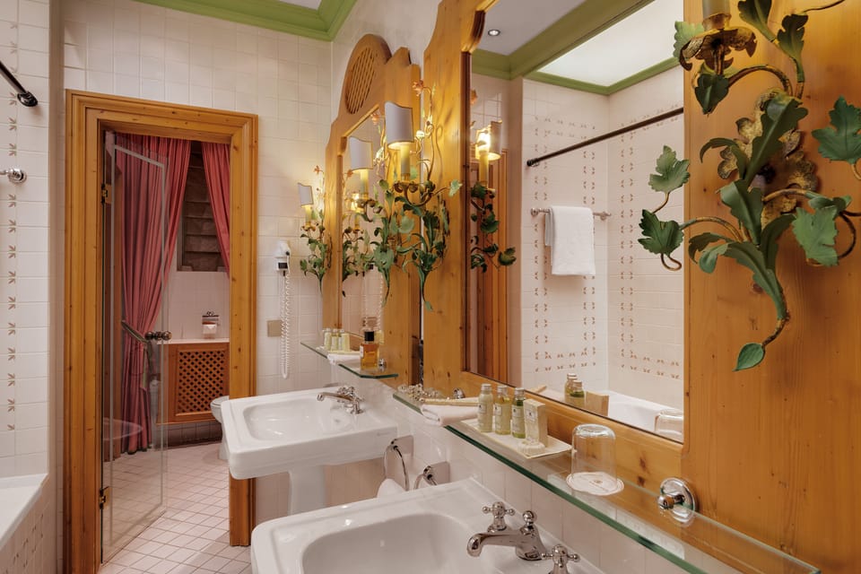 Designer toiletries, hair dryer, bathrobes, slippers