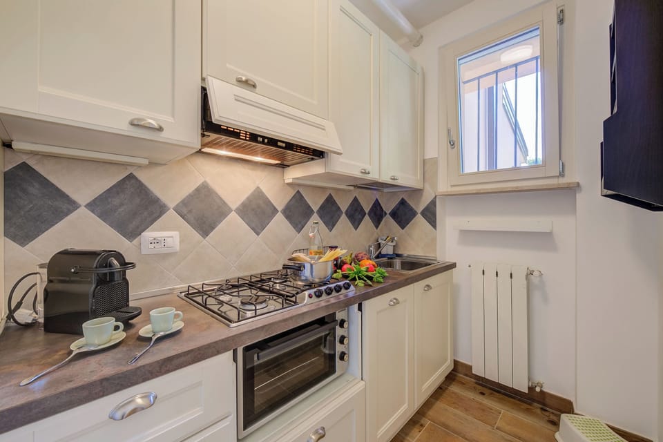 Family Apartment, Multiple Bedrooms, Mountainside (La Casa Accanto With Shared Pool) | Private kitchen | Fridge, oven, stovetop, dishwasher