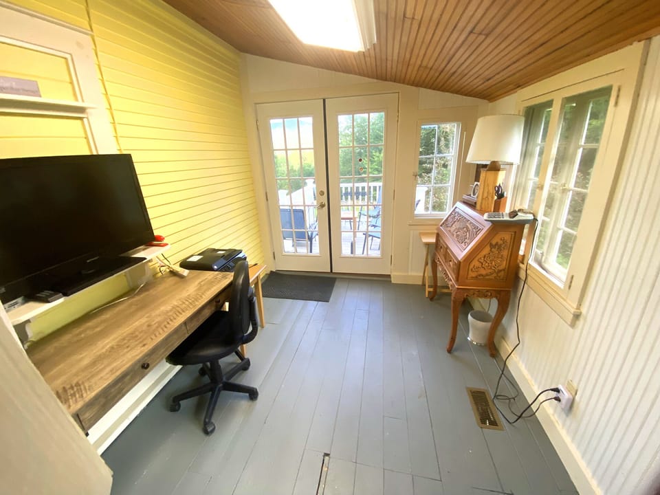 Office area with 2 desks, also walk through to deck overlooking Blue Ridge Mt