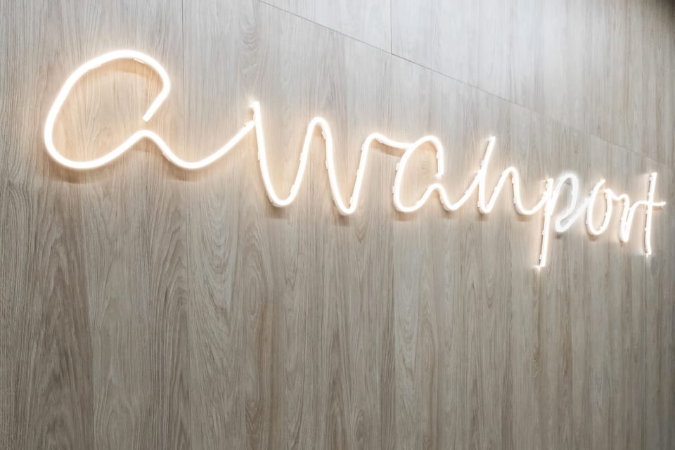 A neon wall sign adding a fun and modern decorative touch to the interior.