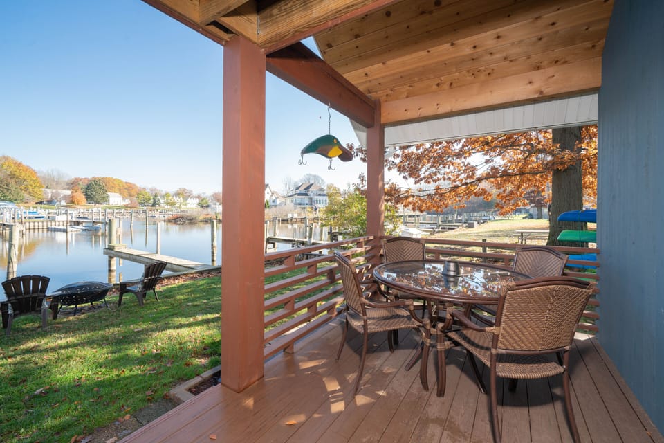 Outdoor dining set; fire pit overlooking the river