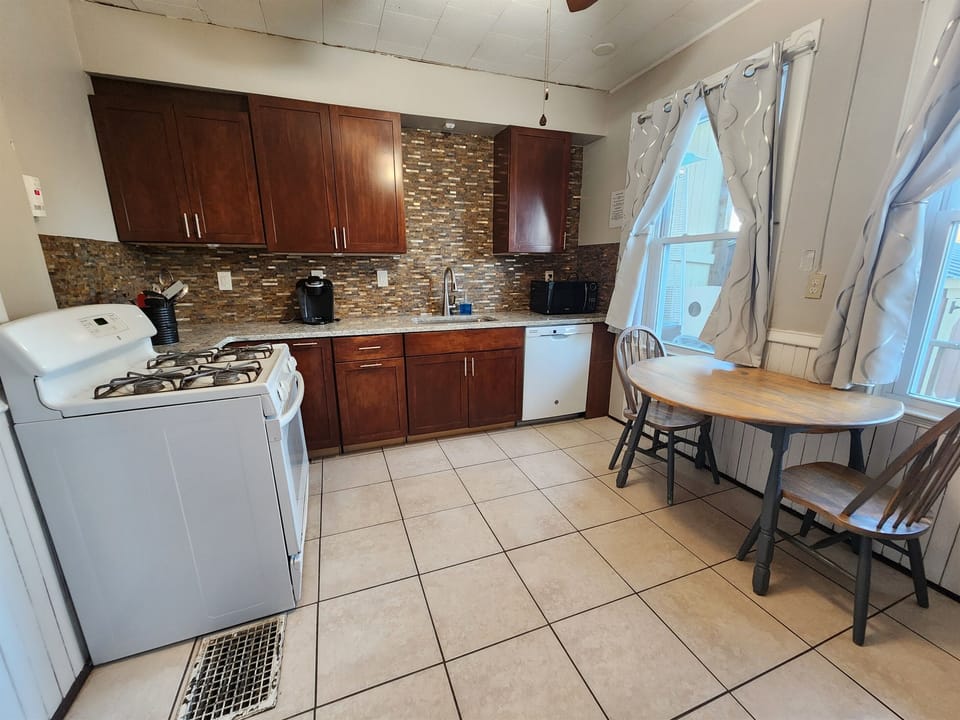 Beautiful eat in kitchen with granite surfaces. 
