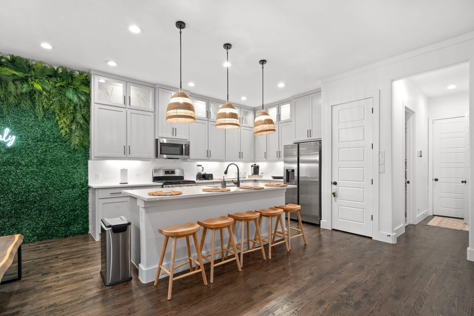 Oversized kitchen island seats a whopping 5 guests. 
