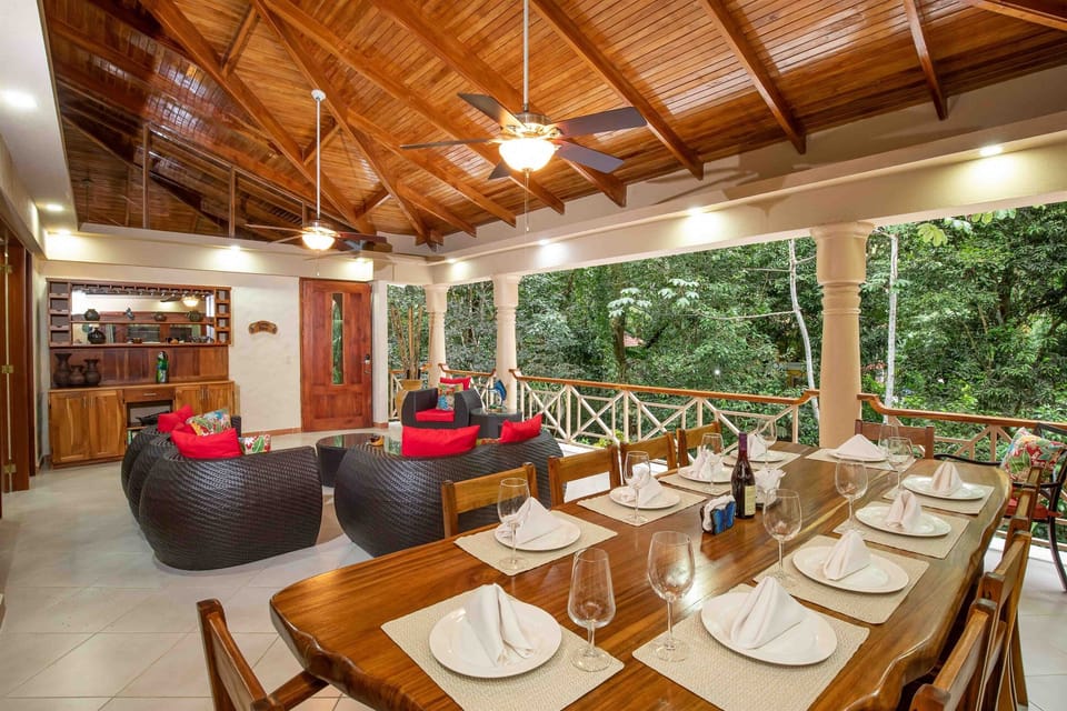 An open-air balcony designed for dining, lounging, and gathering