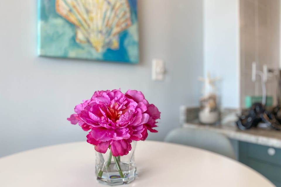 Imagine sharing delightful meals in this thoughtfully designed dining space, where curated decor fosters a warm and inviting ambiance.