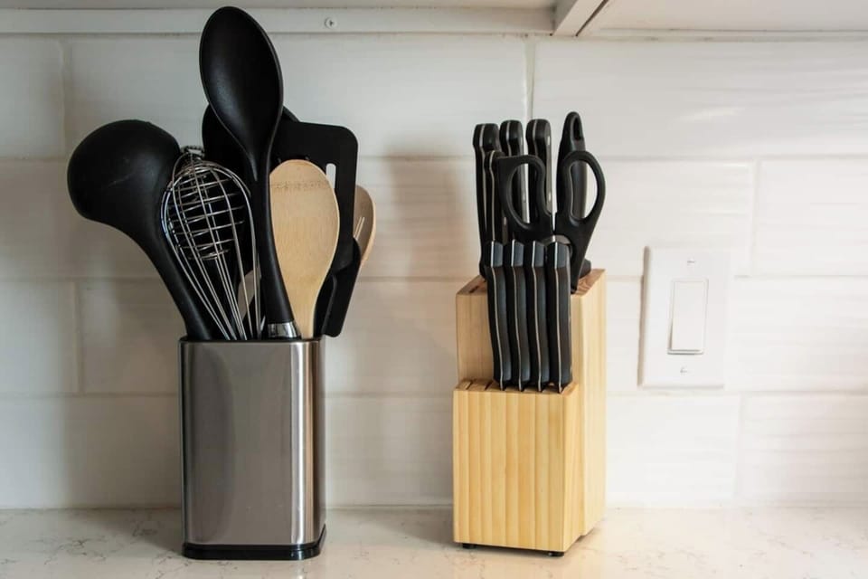 Kitchen cookware and steak knives.  Drawer and cupboards fully stocked with utensils, plates, bowls, and glasses.  Everything you could need to have a comfortable stay.