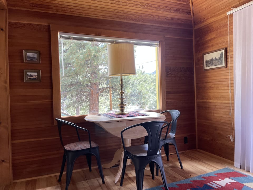 Living room game table, eating or just gazing at view. 